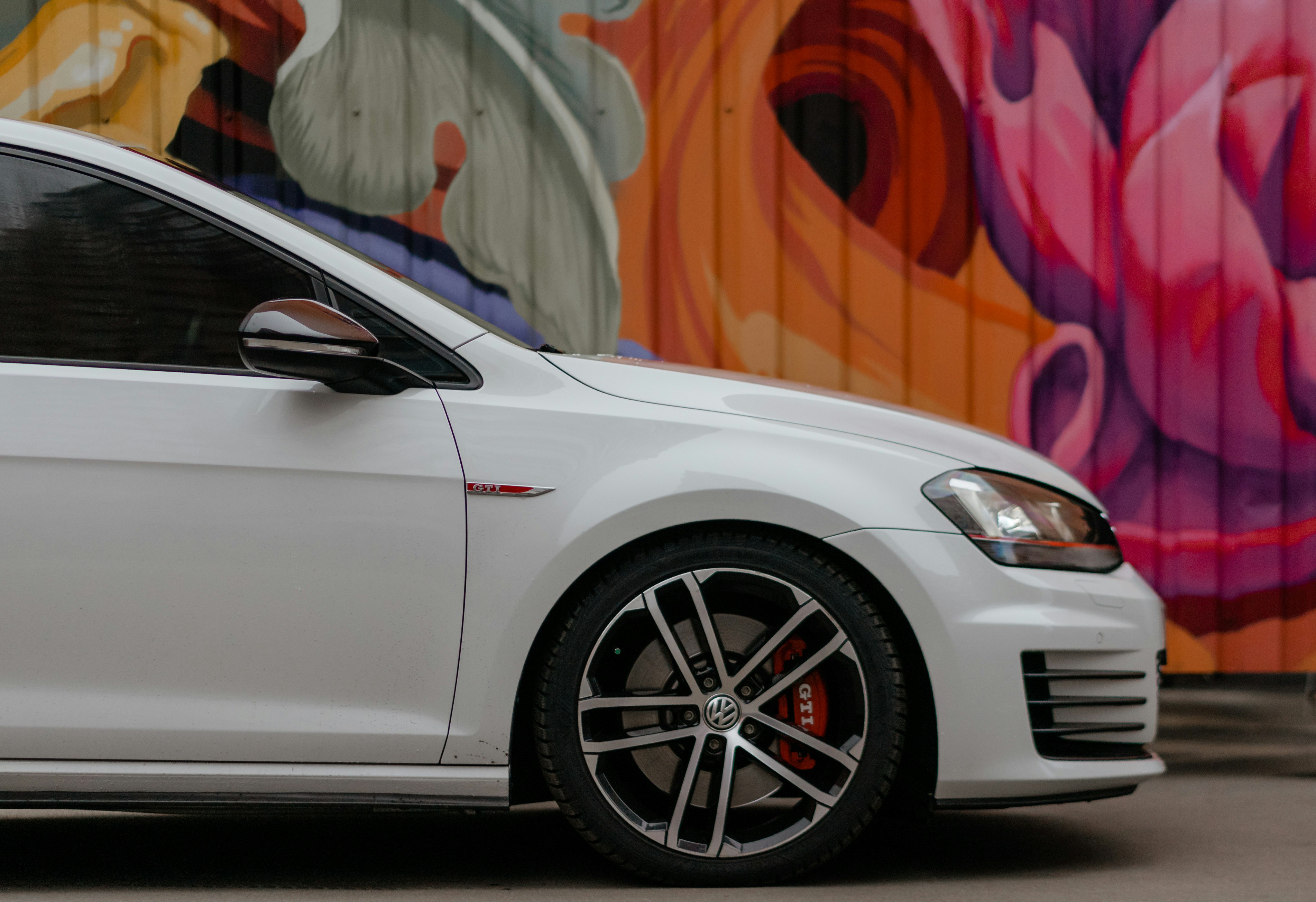 white bmw m 3 coupe parked on parking lot